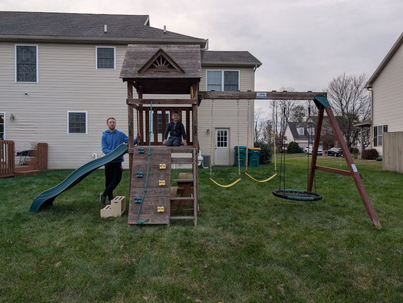 Caleb Playing With His Uncle Ryan on His New Playset