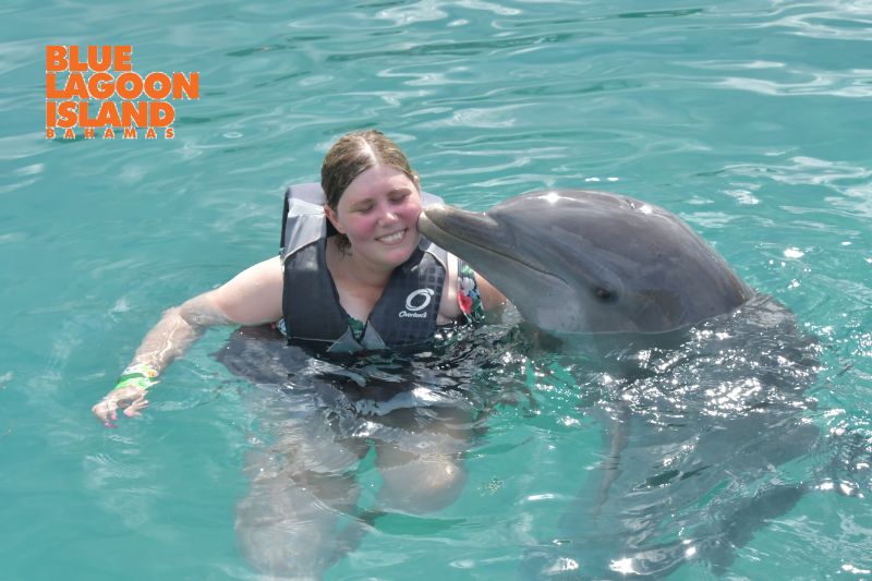 Nicole Getting a Kiss From a Dolphin