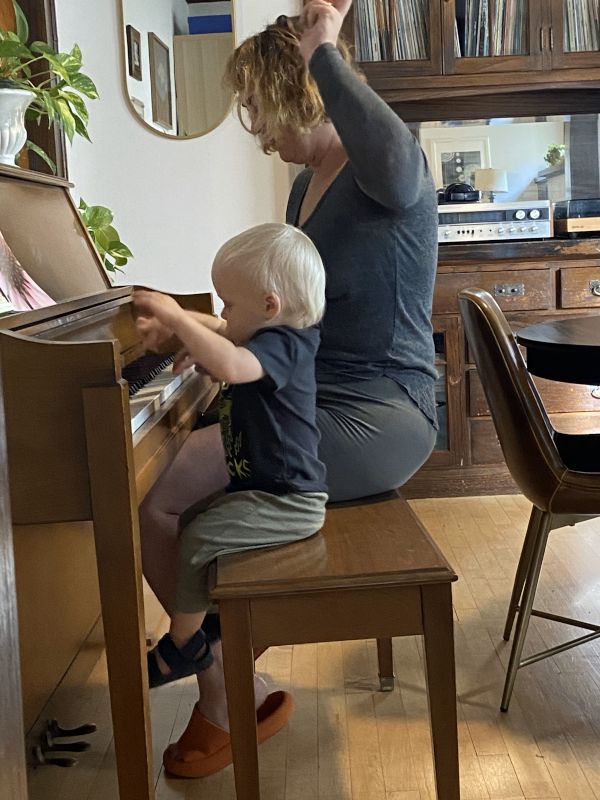 Megan Teaching Her Nephew How to Play Piano