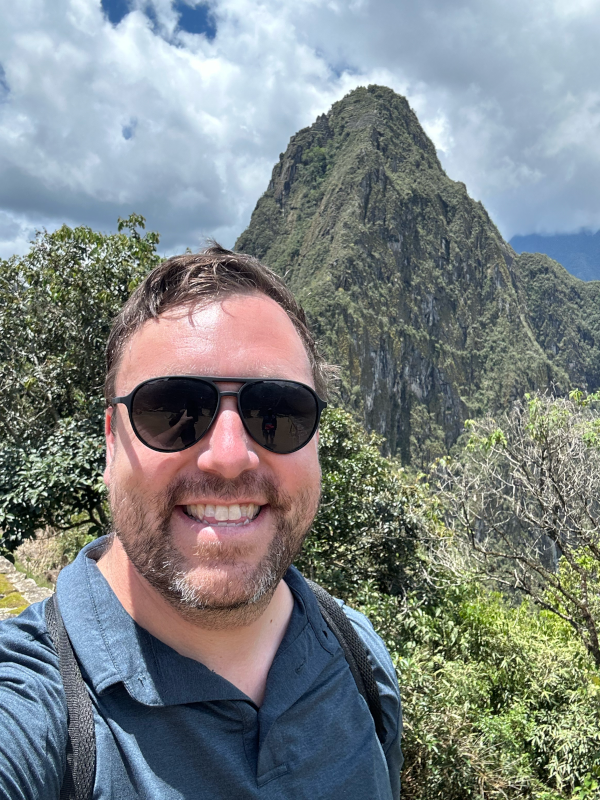 Tom at the Top of Machu Picchu in Peru