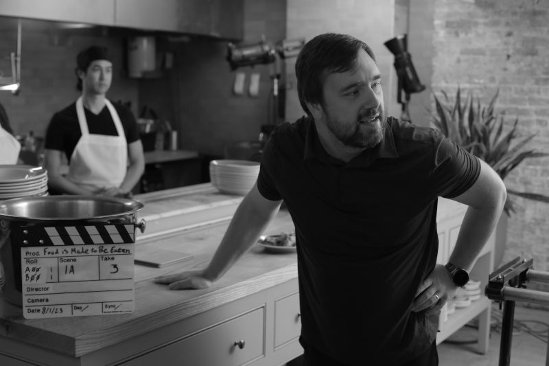 Tom Talking to His Crew on Set