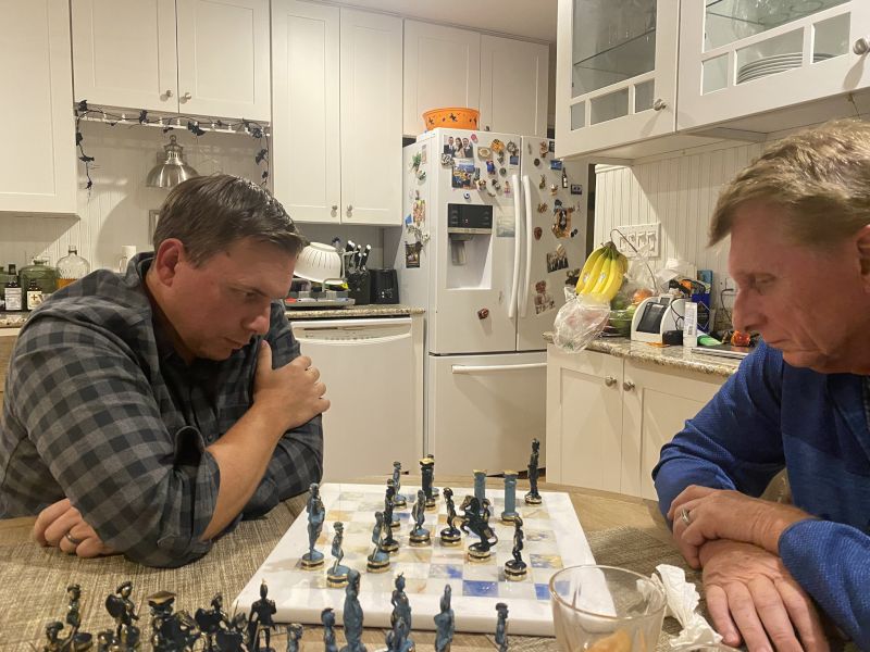 Brian and His Dad Playing Chess