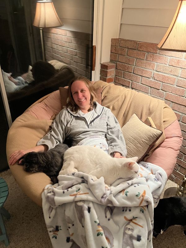 Michelle Snuggling With a Few of the Furballs in Her Favorite Room
